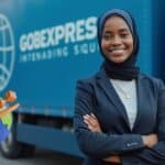 "GOBEXPRESS employee with international shipping truck and global connectivity symbol